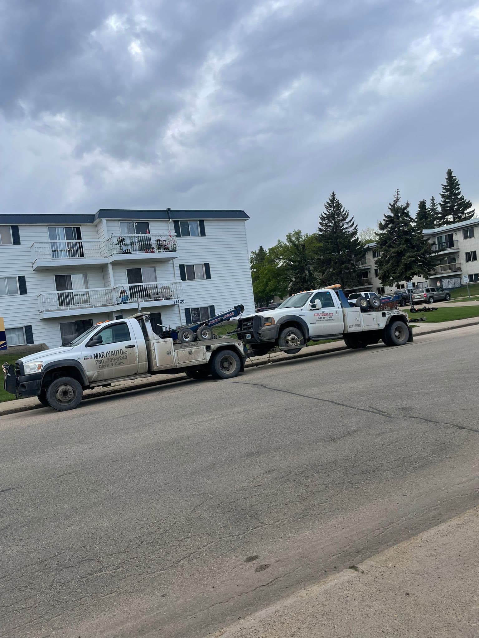 Cash 4 Cars tow trucks parked on an Edmonton street